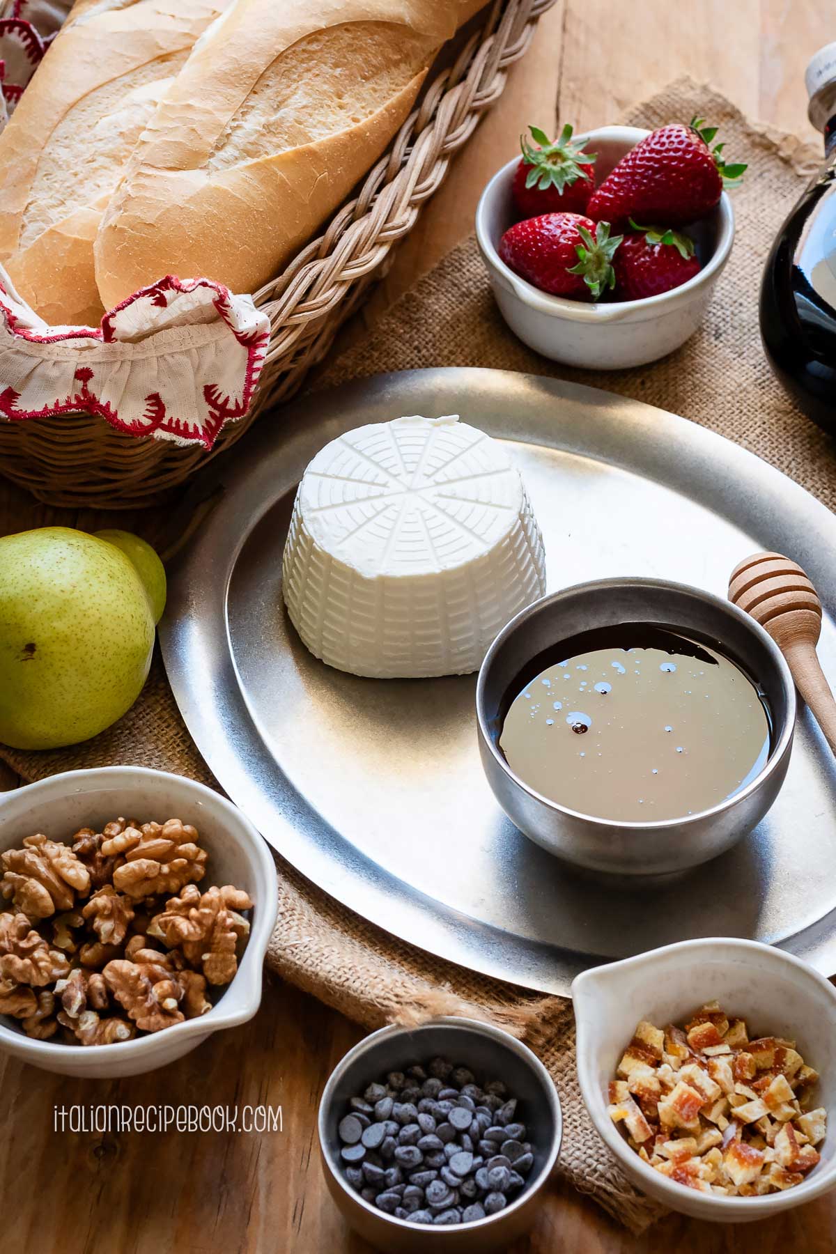 Ingredients needed to make sweet ricotta crostini laid on the table.