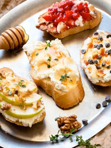 Sweet ricotta crostini on a platter.