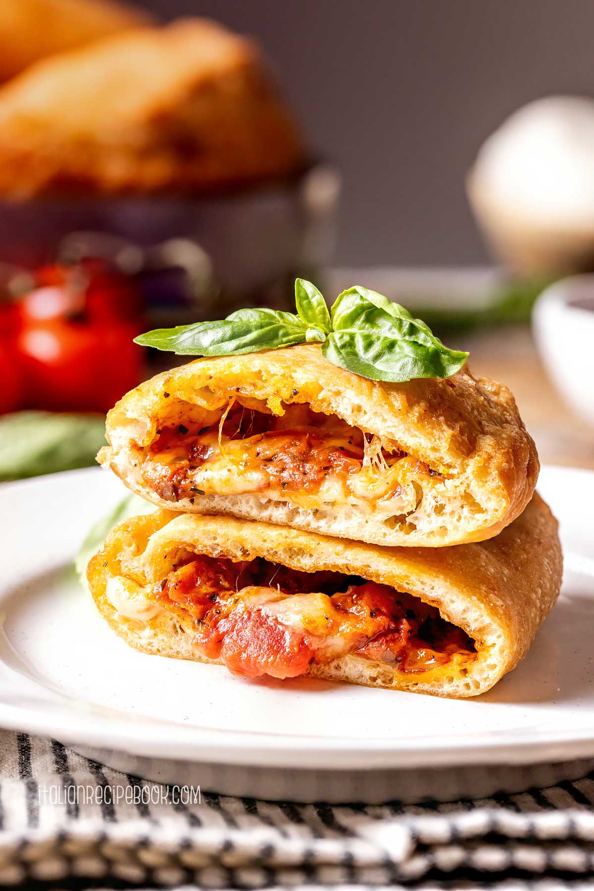 panzerotti cut in half with the filling leaking out