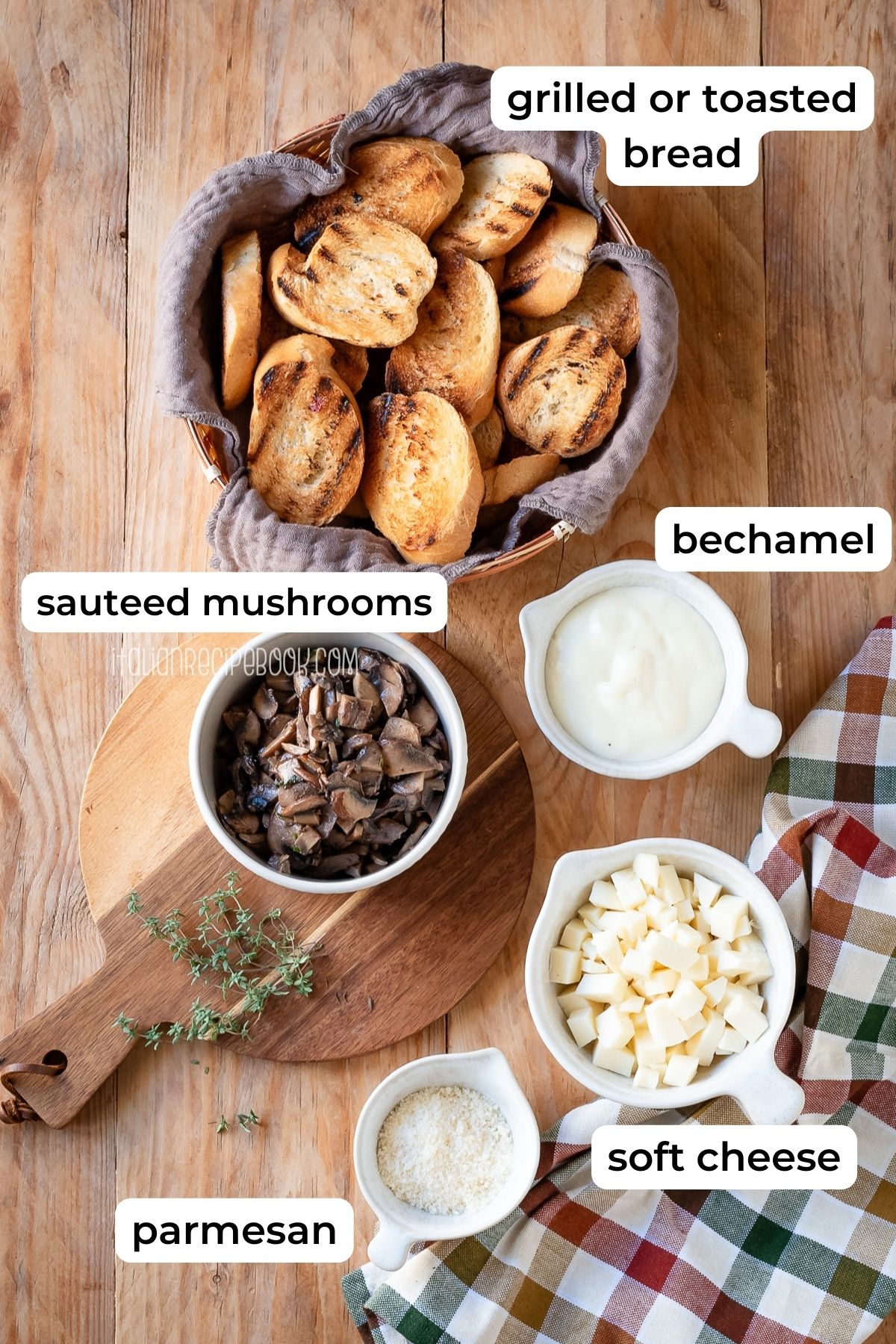 Ingredients needed for mushroom crostini laid on a wooden surface.