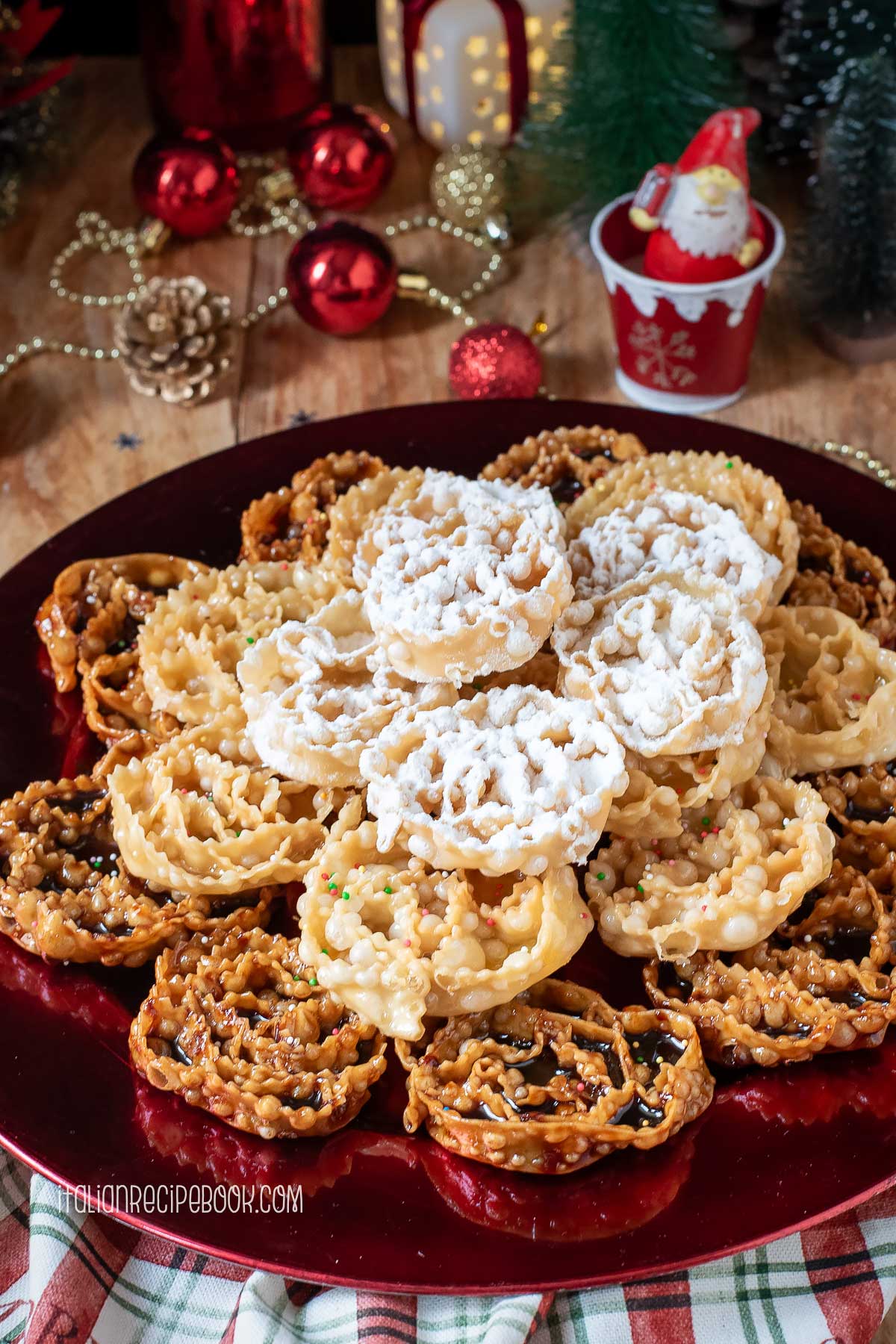 cartellate dipped in vincotto, honey and dusted with powdered sugar