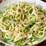 Puntarelle in a bowl with dressing.