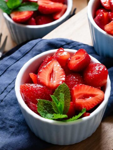 Macerated Strawberries in individual serving bowls.