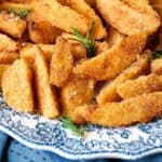 Parmesan potatoes on a serving plate.