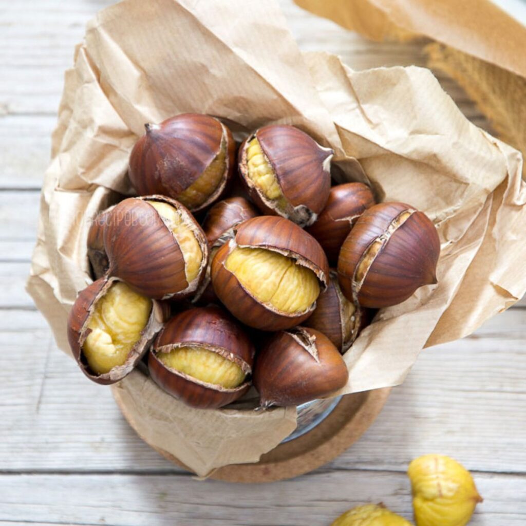 Roasted chestnuts in a paper bag.